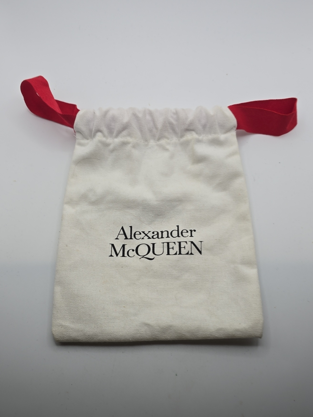 Alexander McQueen Cream Drawstring Pouch with Red Ribbon